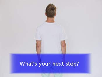 person facing white wall with banner stating What is your next step?